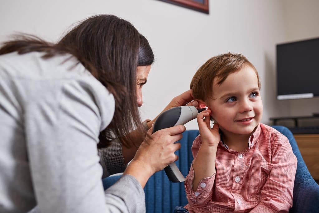 Dr Annie checks child's ear