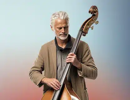 Bernafon older-man-playing-contrabass-blue-rose